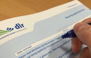 Hand filling out application form Hand filling out application form