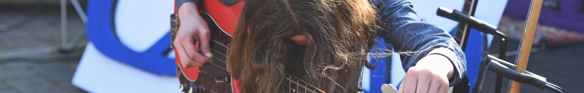 Image of young person with guitar