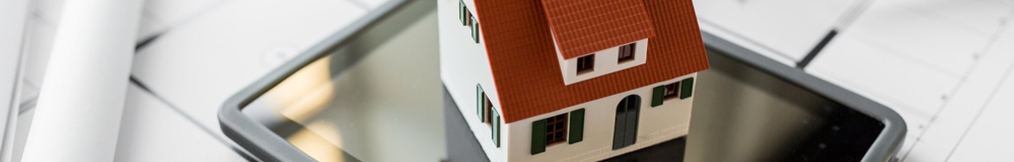 measuring tape, drawings, house model, ipad