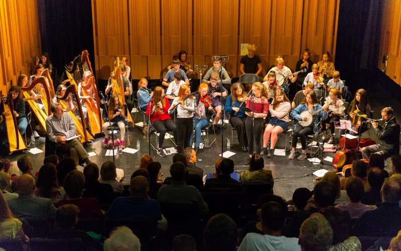 photo of all the musicians on stage for the Dinnseanchas concert