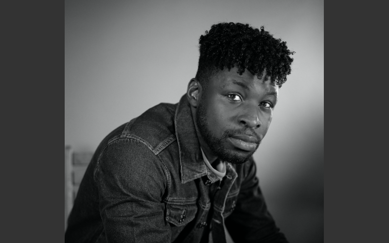 black and white photograph of director Derek Ugochukwu
