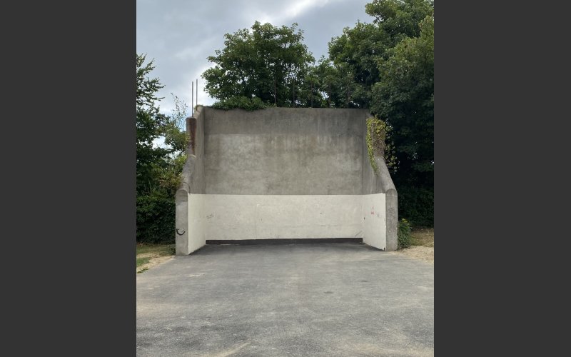 photo of an empty concrete handball court in a park