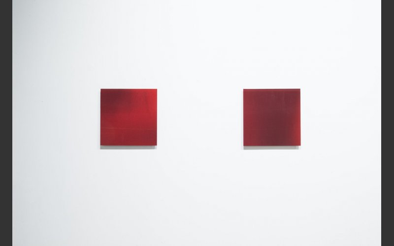 picture of two square red glass artworks