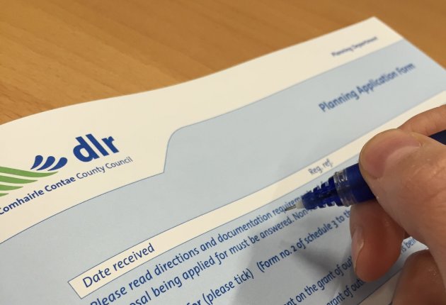 Hand filling out application form Hand filling out application form