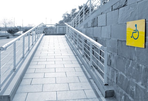 Wheelchair access ramp with signage Wheelchair access ramp with signage