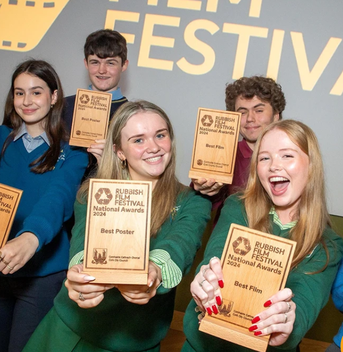 Rubbish film awards winners holding up their awards