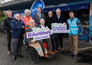 Group image with Cathaoirleach and Councillor on bike 