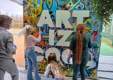Young people taking part in spray painting workshop