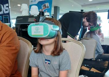 A young girl wearing a vr headset