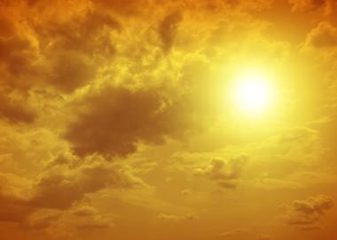 Yellow sun with clouds