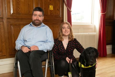Newly Elected DCG Chair, Seán O’Kelly & Outgoing Chair, Helena Mollaghan, Vision Ireland and Fionn, Helena’s Guide Dog.