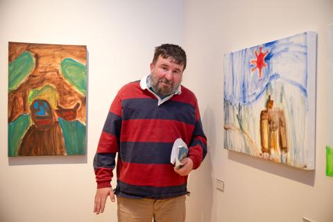 Artist Fergus Fitzgerald with his artworks at the opening of Lifework Exhibition at dlr LexIcon