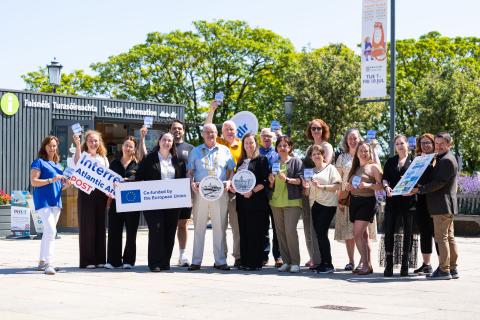 The Dún Laoghaire Passport launch with An Cathaoirleach, Councillor Jim Gildea at dlr, local business owners and dlr staff holding up plagues advertising the Dun Laoghaire passport.