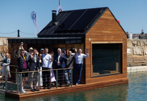 floating sauna on water with people
