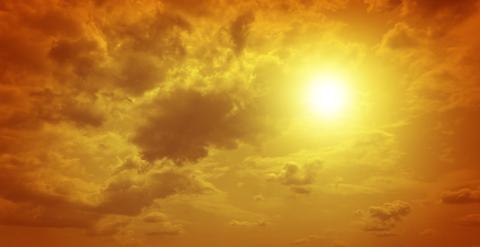 Yellow sun with clouds