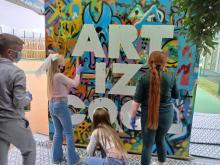 Young people taking part in spray painting workshop