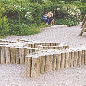 Wooden blocks in a playground make a shape