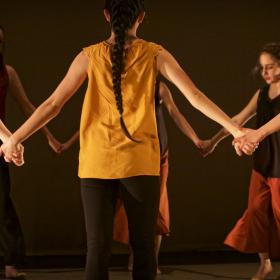 Dancers holding hands