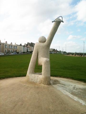 Concrete sculpture of an archer