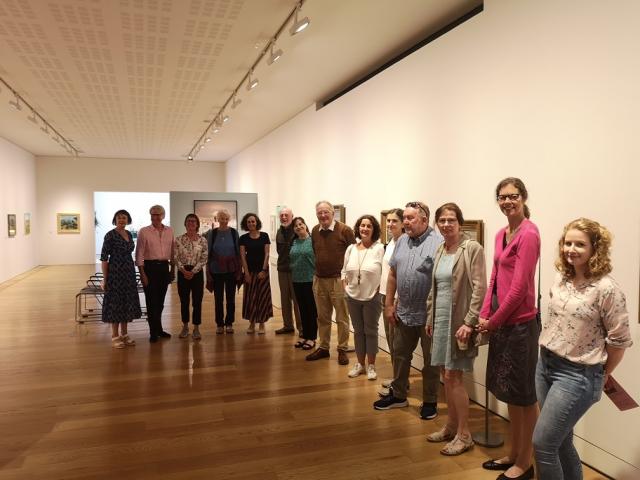 a line of people at the gallery exhibition launch