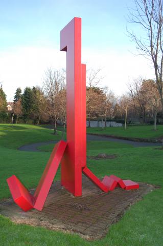 Abstract red metal sculpture.