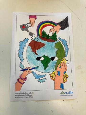 Coloured in Drawing of the Planet Earth coloured in drawing of planet earth with hands painting, cleaning and watering the earth