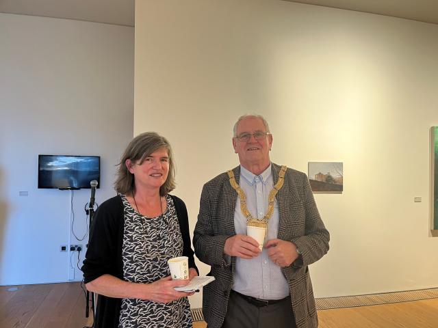 the artist Maeve McCarthy is photographed standing next to an Cathaoirleach Jim Gildea.