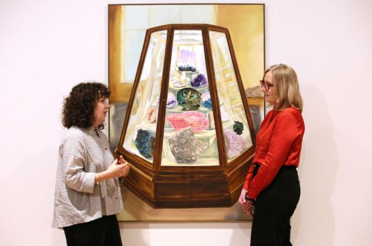 A photo of artist Bennie Reilly Margarita Cappock at the launch of Follow Your Dream exhibition with a sculptural piece of artwork.