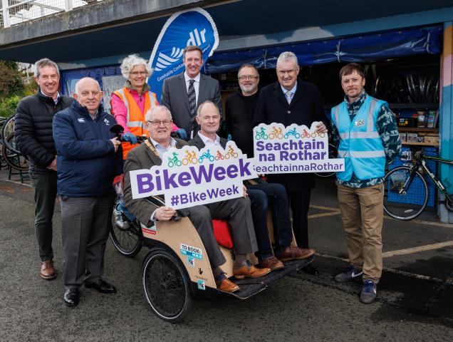 Group image with Cathaoirleach and Councillor on bike