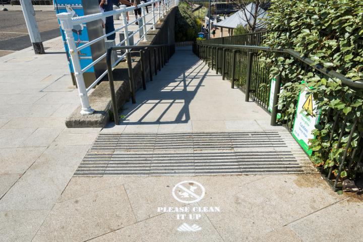 Spray-painted stencils on a footpath