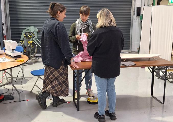 Participants take part in a hands-on repair session at a Repair Café workshop in Sandyford.