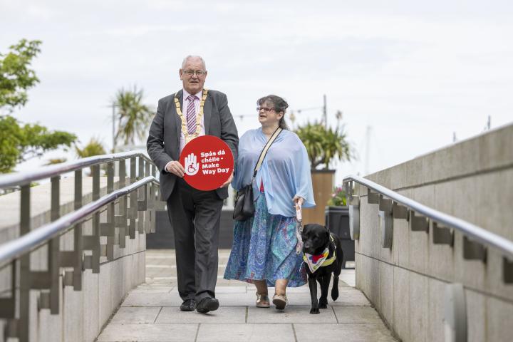 An Cathaoirleach of Dún Laoghaire- Rathdown County Council, Jim Gildea with Audrey Tormey, Secretary of DLR Disability Consultation Group and Audrey’s Guide Dog, Laune.