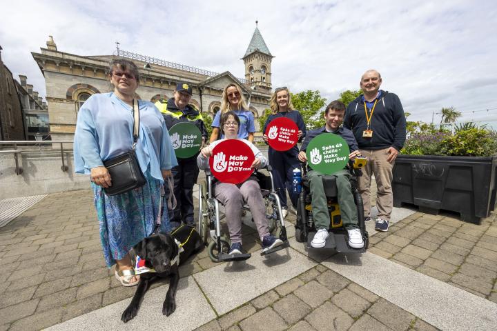 A group photo of dlr staff and members of the DCG standing outside the County Hall in Dun Laoghaire