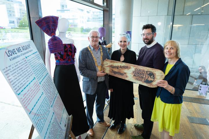 An Cathaoirleach, Councillor Jim Gildea, Deirdre Fitzgerald, Assistant Principal, Dublin College Sallynoggin; Alan Lee, dlr Climate Action Team Green Business Officer and Margaret Coles, dlr Climate Action Team Coordinator standing together holding a wooden plaque that says 'Taking Action Together'.