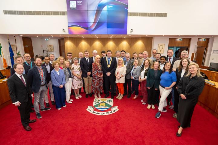 group of people in council chamber
