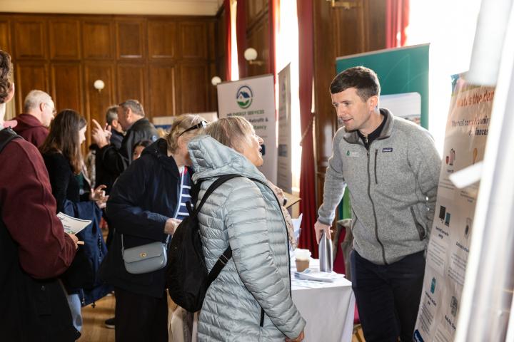 Energy experts provide advice and information to attendees.