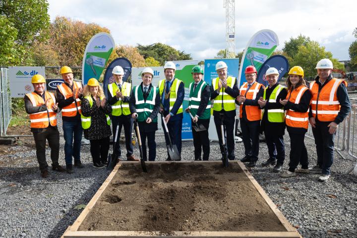 Group image on constuction site of Councillor Oisín O'Connor, Councillor John Hurley, Councillor Fiona Murray, Gerard O’Sullivan, Director of Housing, DLR, John Cummins T.D., Minister of State, Barry Saul, Cathaoirleach, DLR, James Browne T.D., Minister for Housing, Local Government and Heritage, Frank Curran, Chief Executive, DLR, Councillor Liam Dockery, Shay Brennan T.D., Councillor Eva Dowling, Councillor Michael Fleming