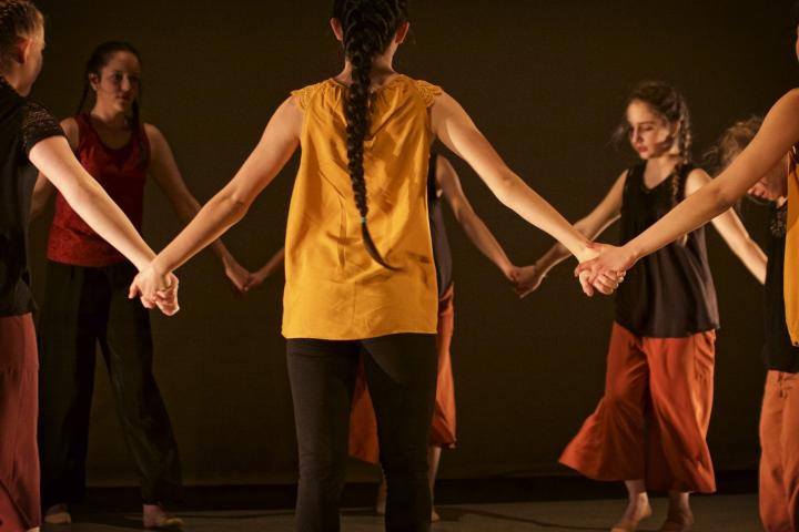 Dancers holding hands