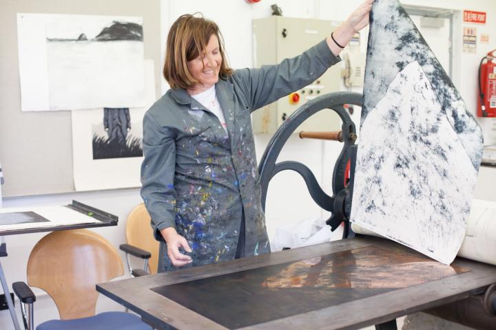 photo of Cora Cummins at work in her studio
