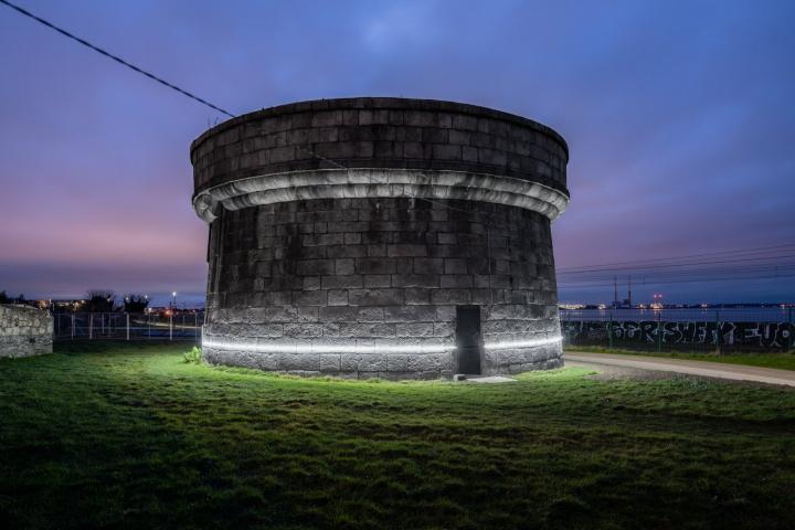A night time shot of Martello Tower wrapped with solar powered ‘line of light’