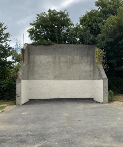photo of an empty concrete handball court in a park
