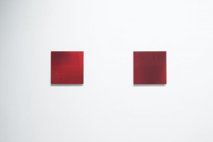 picture of two square red glass artworks